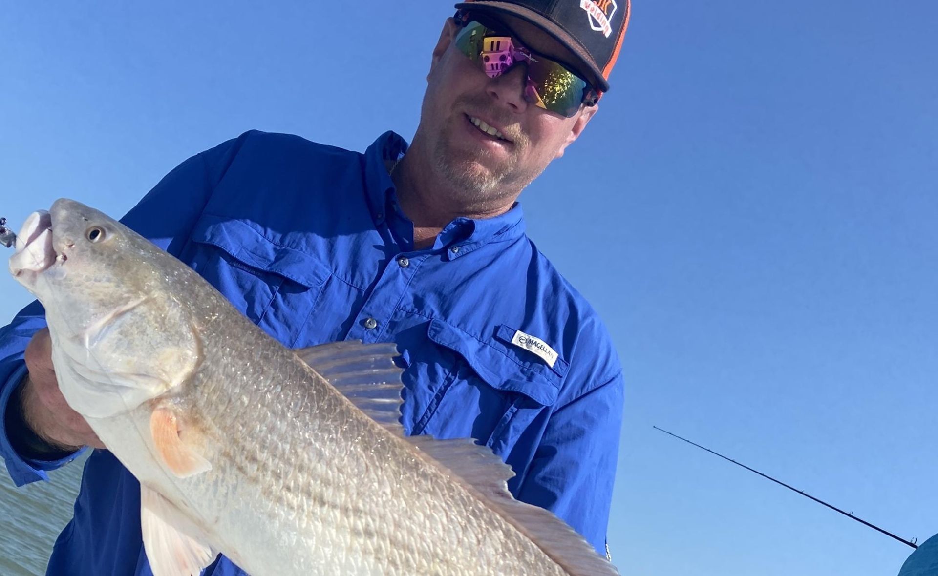 Angler with a trophy speckled trout on the Texas coast